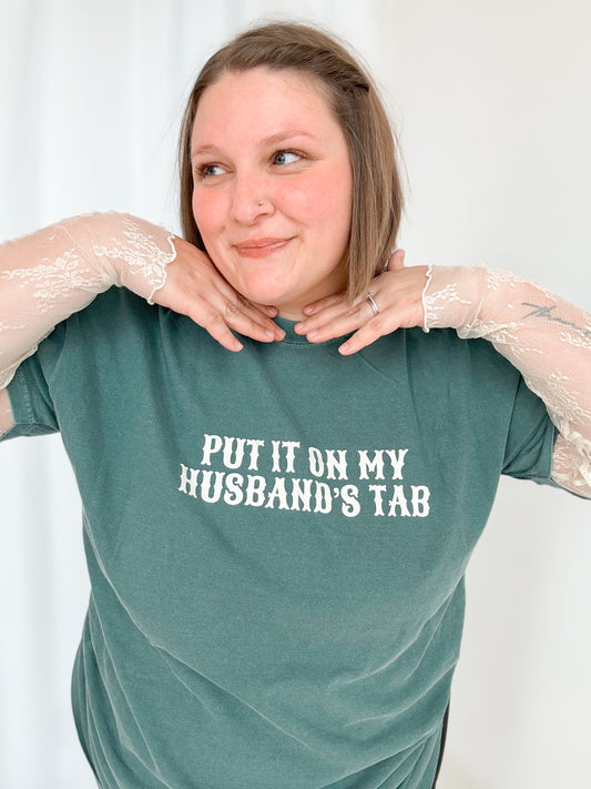 Put It On My Husband’s Tab Graphic Tee